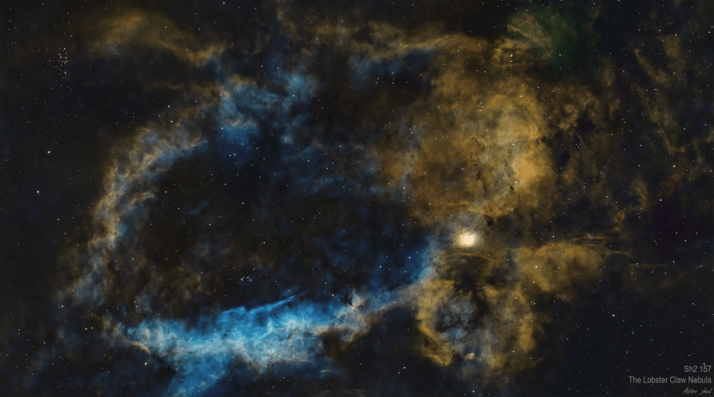 A colorful image of the Lobster Claw Nebula, showcasing swirling clouds of gas and dust against a backdrop of stars.